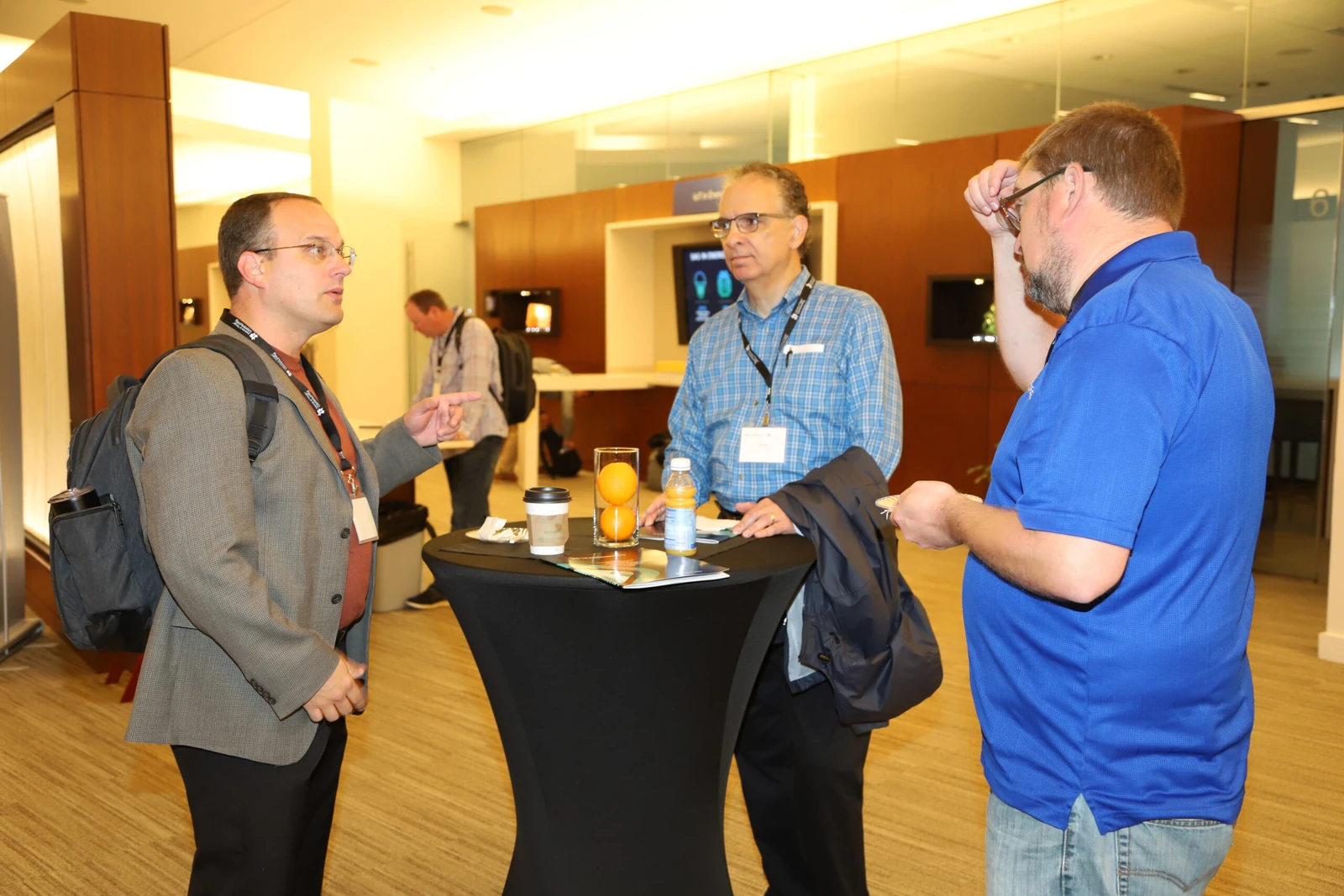IoT Community practitioners meeting around a table at an industry event.